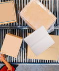 Must Have Packing Paper For Moving And Wrapping Glassware, 100 Sheets Unprinted Protective Cushioning Paper on conveyor with boxes