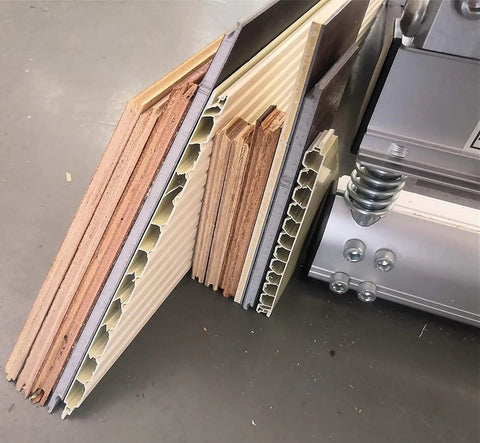 Close-up of Pro Grade Floor Cutter For Laminate And Vinyl With Quick Install Kit, showing various flooring materials it can cut.