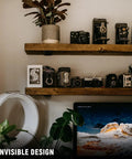 Heavy Duty 6 Inch Floating Shelf Bracket Set, 4 Pack, hidden support in rustic industrial style with decor items displayed.