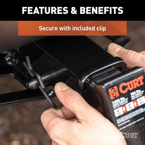 Black Trailer Hitch Pin And Clip With Five Eighths Inch Diameter Fits Two Inch Receiver For Ball Mounts And Trailer Accessories Easy Grip With A 105 Degree Bend For Class 3 4 And 5 Hitches being installed.