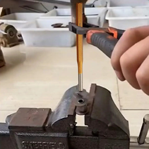 6-Piece Alloy Steel Chisel Set For Concrete Breaking And Stone Carving in use for metal punching in a workshop vise.