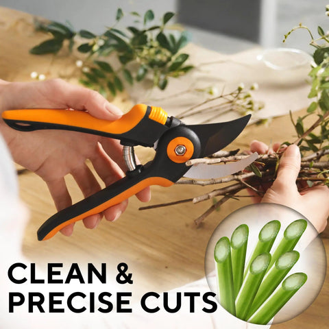 Effortless Garden Pruning Shears With Ultra Sharp Blades cutting plant stems, orange ergonomic handles visible.