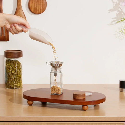Glass Spice Jars Set 24 Pack Four Ounce Square Containers with Airtight Wood Lids and Shaker Pepper Grinder Stainless Funnel in use