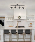Dope Lofty Industrial Four Light Track Lighting Fixture With Pivoting Heads In Matte Black And Brass Accents in modern kitchen