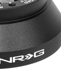 Close-up of Lockable Aluminum Steering Short Hub And Quick Release Adapter Unit With 6x70mm Bolt Pattern in black finish.