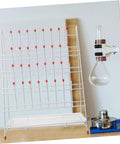 Built Tough White Metal Laboratory Bottle Drying Rack With Thirty Two Pegs For Test Tubes And Glassware on a counter.