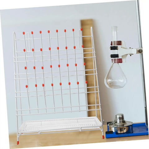 Built Tough White Metal Laboratory Bottle Drying Rack With Thirty Two Pegs For Test Tubes And Glassware on a counter.