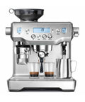 Oracle Fully Automatic Espresso Machine In Brushed Stainless Steel With 58 mm Portafilter Integrated Grinder And Slick Milk Frother dripping espresso into two glasses