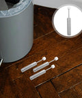 6 Pcs Trash Can Piston Replacement With Soft Close Mechanism Damper displayed near a gray wastebasket on wooden floor