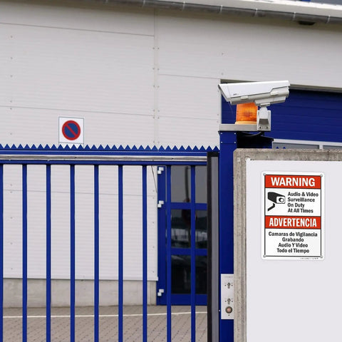 Straight Up Heavy Duty Electric Hazard Warning Sign 8X12 Inch Metal Tin Plate For Multi Circuit Breakers And Dangerous Voltage Lines In Industrial Workshops And Factories Built Tough For Indoor Outdoor Safety Checks A Must Have Shop Staple mounted on a security wall with surveillance camera.