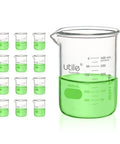 12 Pack 400ml Low Form Beaker Set with Spouts, featuring thick borosilicate glass, industrial chemistry glassware with green liquid.