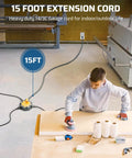 Rock Solid 15 Foot Heavy Duty Extension Cord With Weather Resistant Cover And Six Outlet Power Hub in workshop setting.