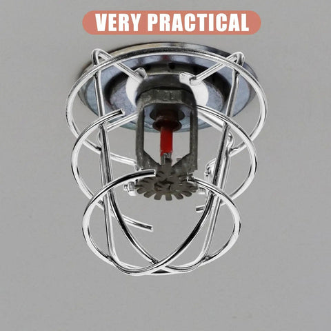 Six Pack Tool Free Fire Sprinkler Head Covers Tough As Nails Protector Cage With Exposed Shackle For Vandalism And Impact Shielding No Sweat Outdoor Setup Bully Proof Safety Gear, silver steel sprinkler head cover close-up.