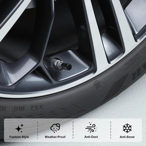 Close-up of a tire with a black valve stem cap from the 12 Pack Tire Valve Stem Caps Black Universal Fit For Cars, SUVs, Trucks, Motorcycles And Bikes Easy To Hand Tighten, Protect Valves From Water, Dust And Sand, Prevent Leaks, Sleek Look For Any Vehicle.