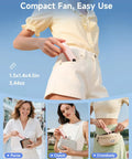 Woman placing Portable Handheld Mini Fan With LED Display, 3-in-1 USB Rechargeable Fan And Flashlight For Travel into her pocket