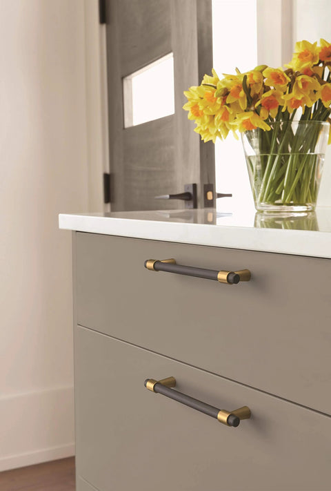 Drawer with Mergence Cabinet Pull in Matte Black Champagne Bronze, Five And One Sixteenth Inch Center To Center, installed in kitchen