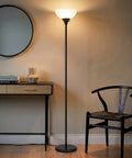 Sky Dome Dimmable LED Floor Lamp For Living Room, Bedroom Or Office In Jet Black Finish, illuminating a cozy corner with warm light.
