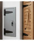 Rock Solid Heavy Duty Black T Shape Iron Hinges Built Like A Tank For Sliding Barn Doors And Fences With Silent Glide Galvanized Coating Quick Snap Install Two Pack Measures Approx 95 By 64 Mm Each on a wood and gray door.