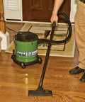 Man using All Purpose Ash Vacuum For Fireplaces And Grills With 10 Amp Power on hardwood floor