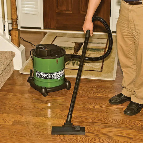 Man using All Purpose Ash Vacuum For Fireplaces And Grills With 10 Amp Power on hardwood floor