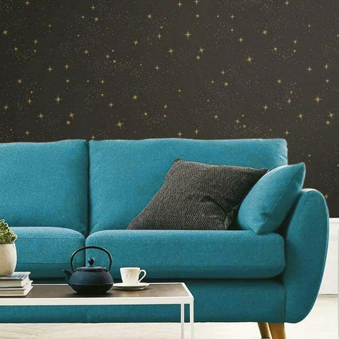 Upon A Star Black And Metallic Peel And Stick Wallpaper Easy Install On Smooth Walls behind blue sofa and table setting