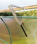 Solar Powered Greenhouse Vent Opener Kit Auto Open Close For Wooden And Aluminum Greenhouses With Temperature Activated Action High Lift Up To 7kg Rust Resistant Aluminum Stainless Steel Construction inside a greenhouse.
