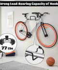 Room with bike mounted on wall using heavy-duty hook, showcasing strong load-bearing capacity, 77 lbs weight illustration