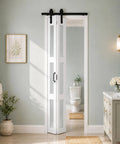 Upgrade Your Living Space With These Kickback Style Bifold Barn Doors Featuring Smooth Gliding Frosted Glass Panels 28X84 Inches in a modern bathroom.