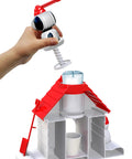 Snoopy House Snow Cone Machine For Kids Hand Crank Shaved Ice Maker With Fruit Punch Flavor Pack being filled with ice.