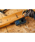 Blaze Green Beam Laser Measure Up To 165 Feet With Real Time Distance Reading on plywood, carpenter marking wood