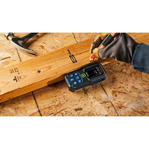 Blaze Green Beam Laser Measure Up To 165 Feet With Real Time Distance Reading on plywood, carpenter marking wood