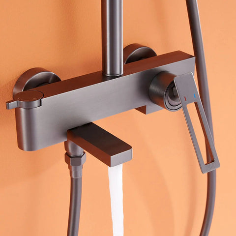 Wall Mounted Exposed Shower System with Tub Spout 90° Rotating Gun Gray faucet detail with square spout and control lever.