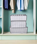 Total Closet Game Changer 3 Pack Seven Grid Foldable Bins With Grippy Handles Ultra Spacious Storage Boxes in closet.