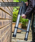 Person holding Twelve And A Half Foot Aluminum Telescoping Ladder That Extends From Compact Fold To Full Height With Non Slip Rungs