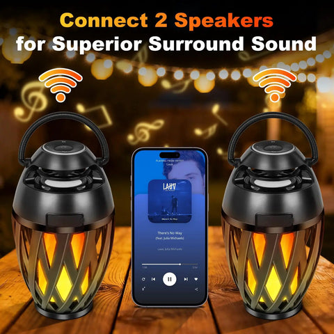 Flame Lamp Speaker With Multicolor Lights For Outdoors Patio Pool Camping Waterproof Torch Lantern 7 Lighting Modes And Music Sync RGB Glow For A Dope Vibe Lit Ambience And Great Gift For Men Him Dad on table with phone