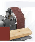 Close-up of the Compact Mini Electric Belt Sander For Desktop Projects with sanding belt and wood piece for precision grinding.