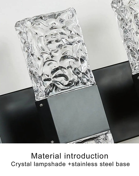 Close-up of Black 4 Light Crystal Bathroom Vanity Light Over Mirror LED Wall Fixture's ice cube crystal detailing and black base.