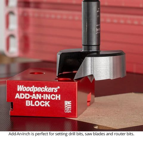 Rugged One Inch Offset Table Saw Fence Stop Featuring Slick Clamp On Design For Rapid Rip Fence Setup And Dead On Repeatable Crosscuts Every Damn Time In Your Workshop resting on a red ADD-AN-INCH block.