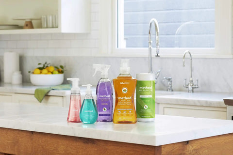 Almond Scent Daily Hardwood Cleaner Pack Of Four For Wood Surfaces Like Tables Shelves And Counters Removes Dust And Grime Without Harming Finish No Harsh Chemicals 28 Oz Bottles Cruelty Free And Safe For Daily Cleaning displayed on kitchen counter