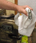 Hand holding Pro Grade 14 By 17 Inch New Terry Bar Towels Cotton Blend Absorbent Rags for Restaurant Kitchen Cleaning