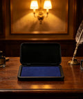 Dead Zero Smudge Fast Dry Pigment Ink Pad For Rubber Stamps and Official Signatures on a wooden desk with vintage items.