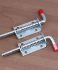 Premium Stainless Steel Spring Loaded Gate Latch And Bolt Hardware Set For Utility Dump Trailers Barn Doors showing two latch bolts on wood background.