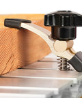 Close-up of Two Pack T Track Hold Down Clamps Kit with Aluminum Alloy Press Plate Clamps for CNC Router, securing wood.