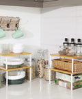 Stackable Cabinet Organizer Shelves Set Of 4 Hella Super Convenient Kitchen Pantry Storage on countertop with dishes and jars.