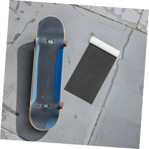 Heavy Duty Skateboard Grip Tape For Longboards And Electric Scooters Non Slip PVC Deck Cover with a skateboard on pavement