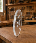 Six Inch Clear Acrylic Router Base Plate With Precision Pre Drilled Holes For DWP611 And DCW600B Compact Routers on wooden workbench.
