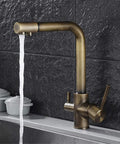 360-Degree Rotating Antique Bronze Kitchen Faucet Water Purifier 3-Way Dual Filter Tap stylishly dispensing water in a modern kitchen.