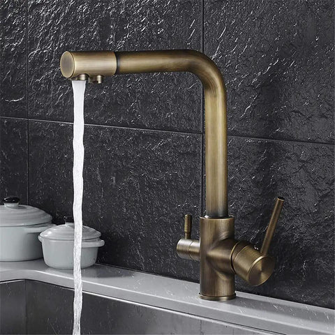 360-Degree Rotating Antique Bronze Kitchen Faucet Water Purifier 3-Way Dual Filter Tap stylishly dispensing water in a modern kitchen.
