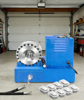Built Tough Electric Hydraulic Hose Crimper With Eight Dies, high-pressure tool with hoses, in a garage setting.