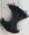 No Fancy Tools Needed Five Inch Black Plastic Hang Tag Fasteners One Thousand Pack shown in a pile, ideal for clothing and accessories.